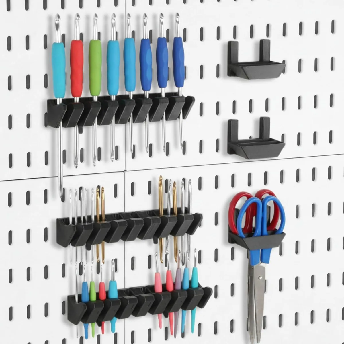 Six black plastic pegboard holders: three long screwdriver racks with eight slots and three short plier clips with two slots