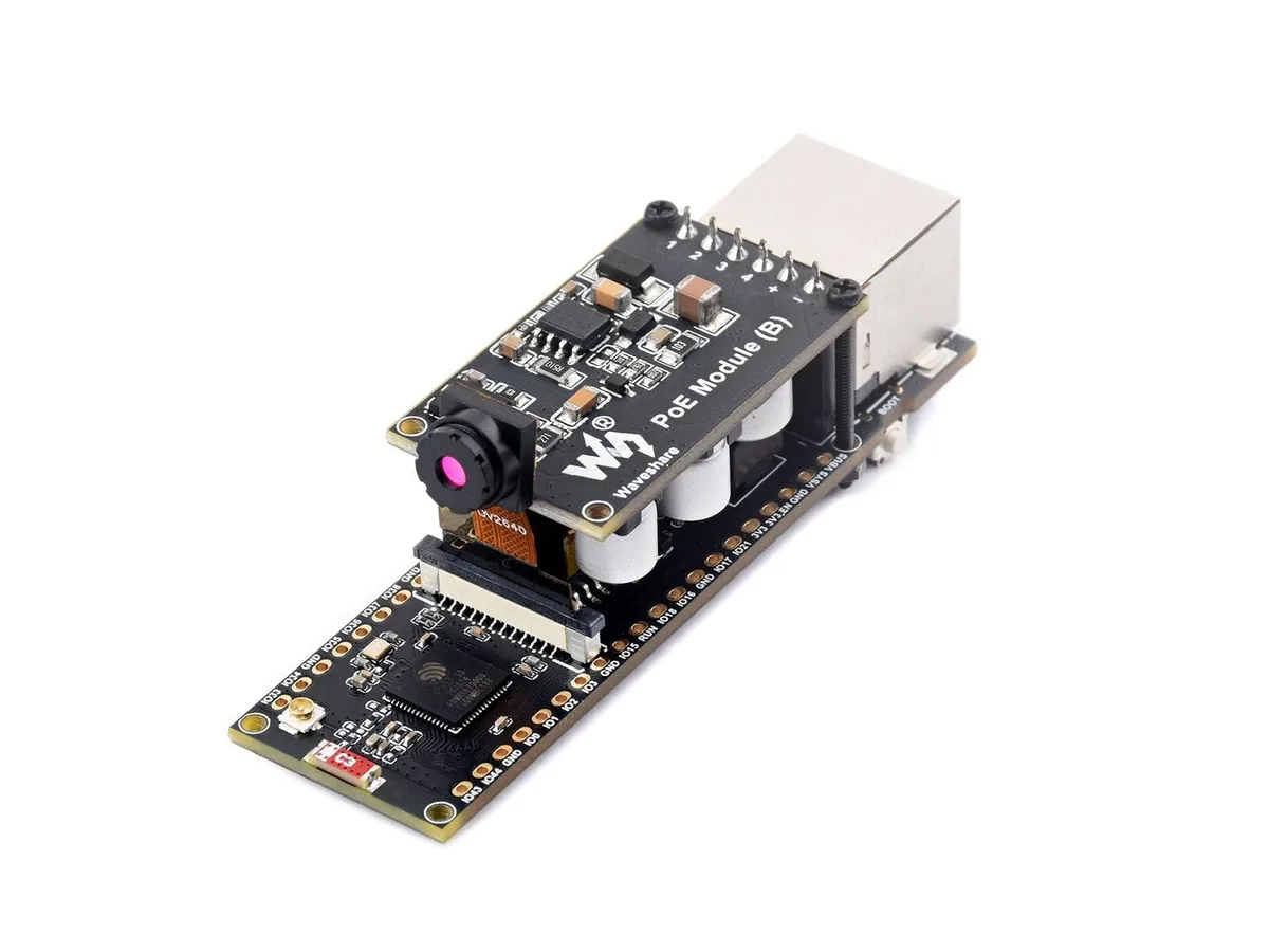 Green rectangular PCB with silver RJ45 port, black USB-C connector, small camera module and PoE daughterboard attached