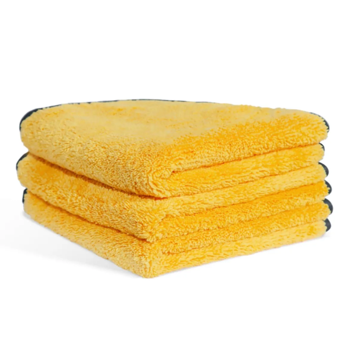 Three folded grey microfiber towels in clear vacuum-sealed bag