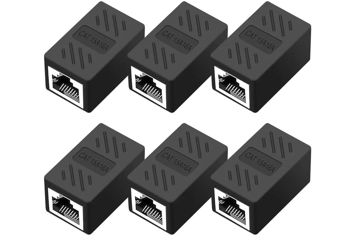 Six small black rectangular RJ45 couplers with gold contacts