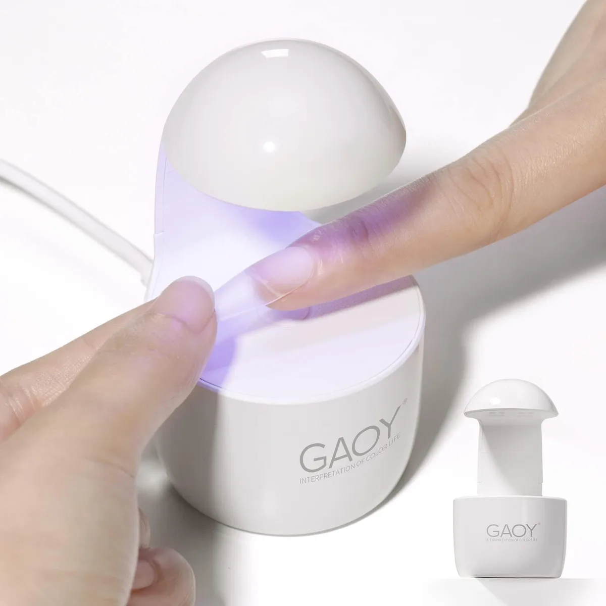 Small white UV nail lamp with four LED units, egg-shaped finish
