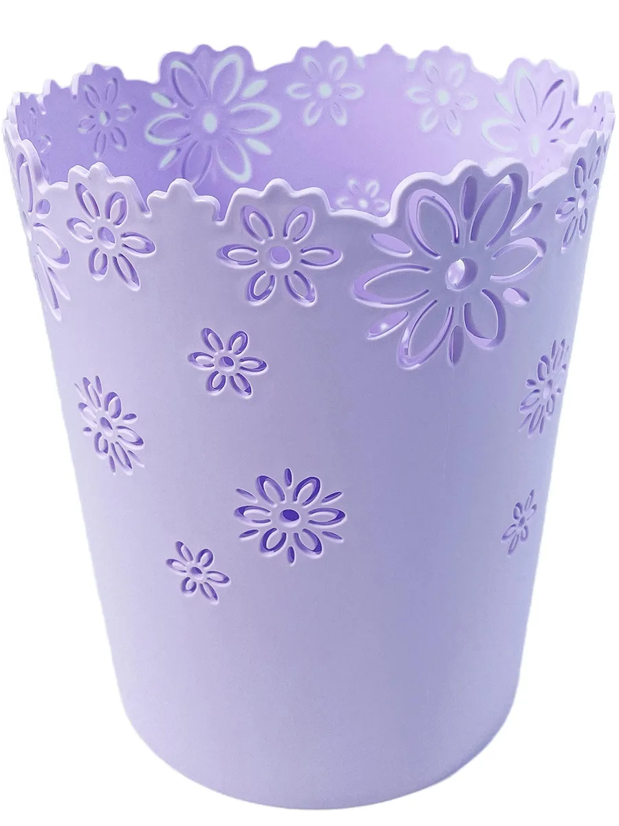 Twelve small purple plastic wastebaskets with hollow flower-pattern sides and open tops
