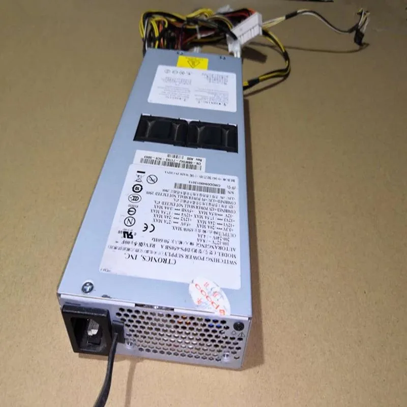 Rectangular ATX power supply unit with matte black metal casing and cooling fan grille