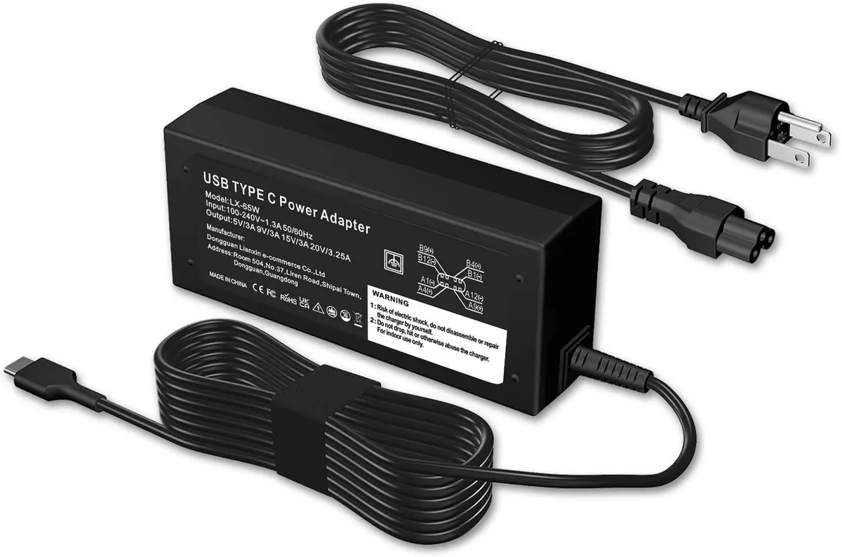 Compact 65W USB-C power adapter, matte black rectangular brick with integrated cable