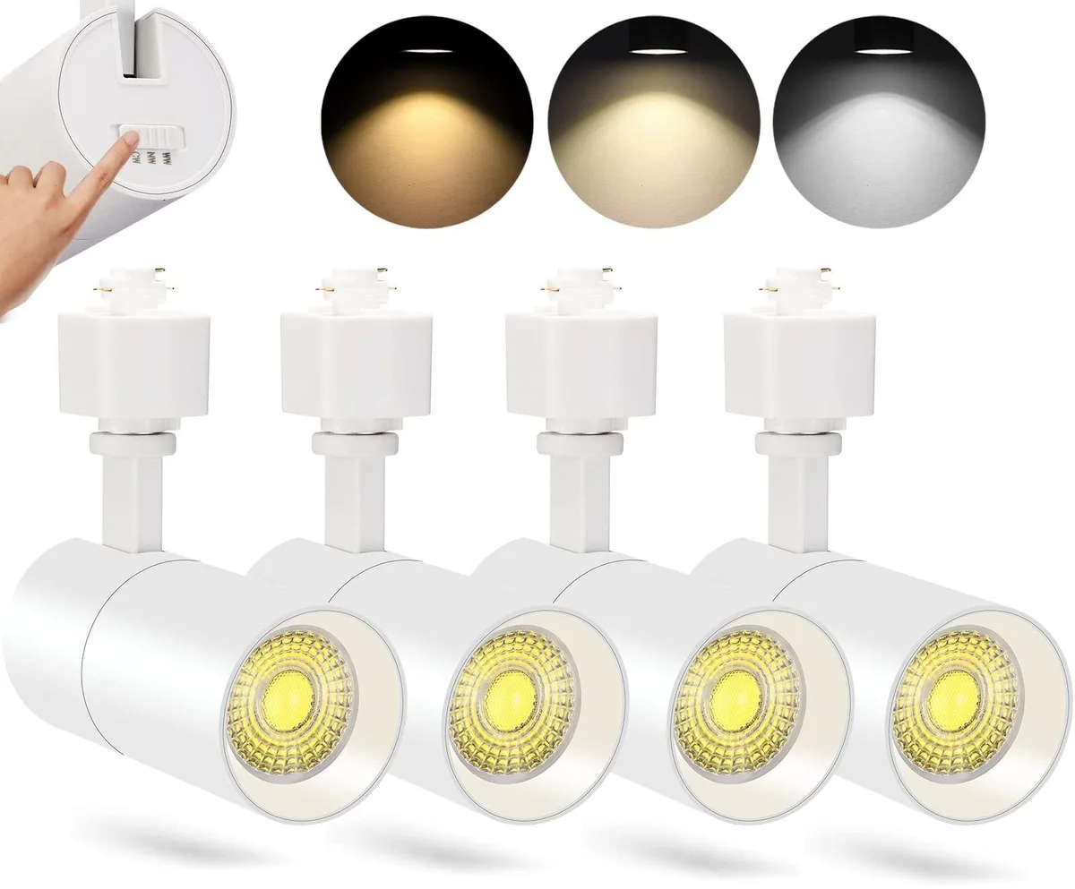 Four matte-white aluminium LED track heads with rear colour sliders