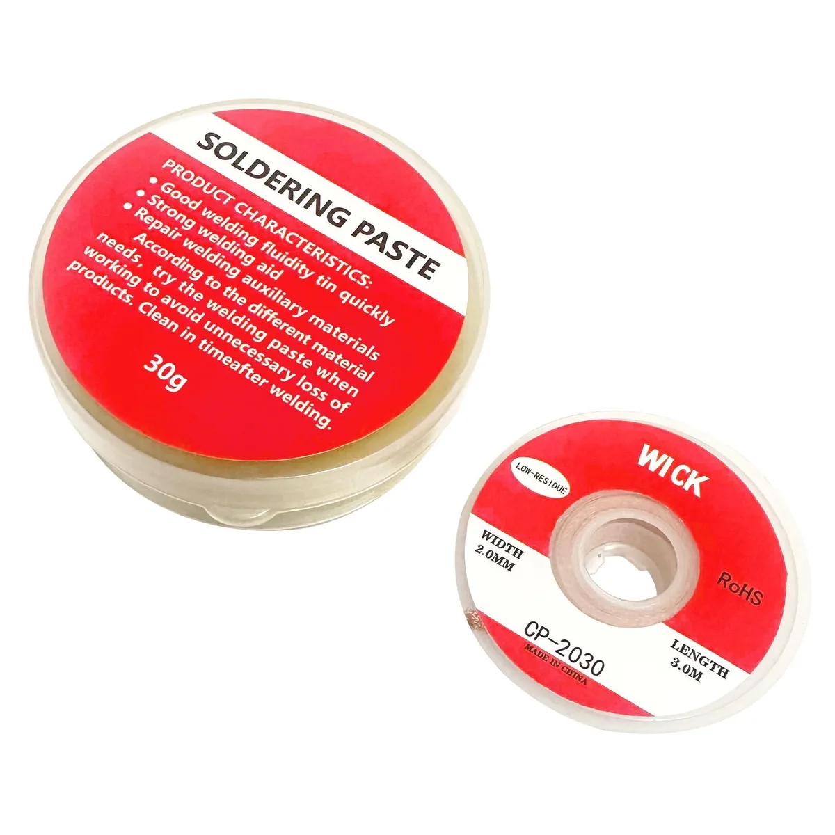 A small box of rosin solder paste flux and a spool of copper desoldering wick