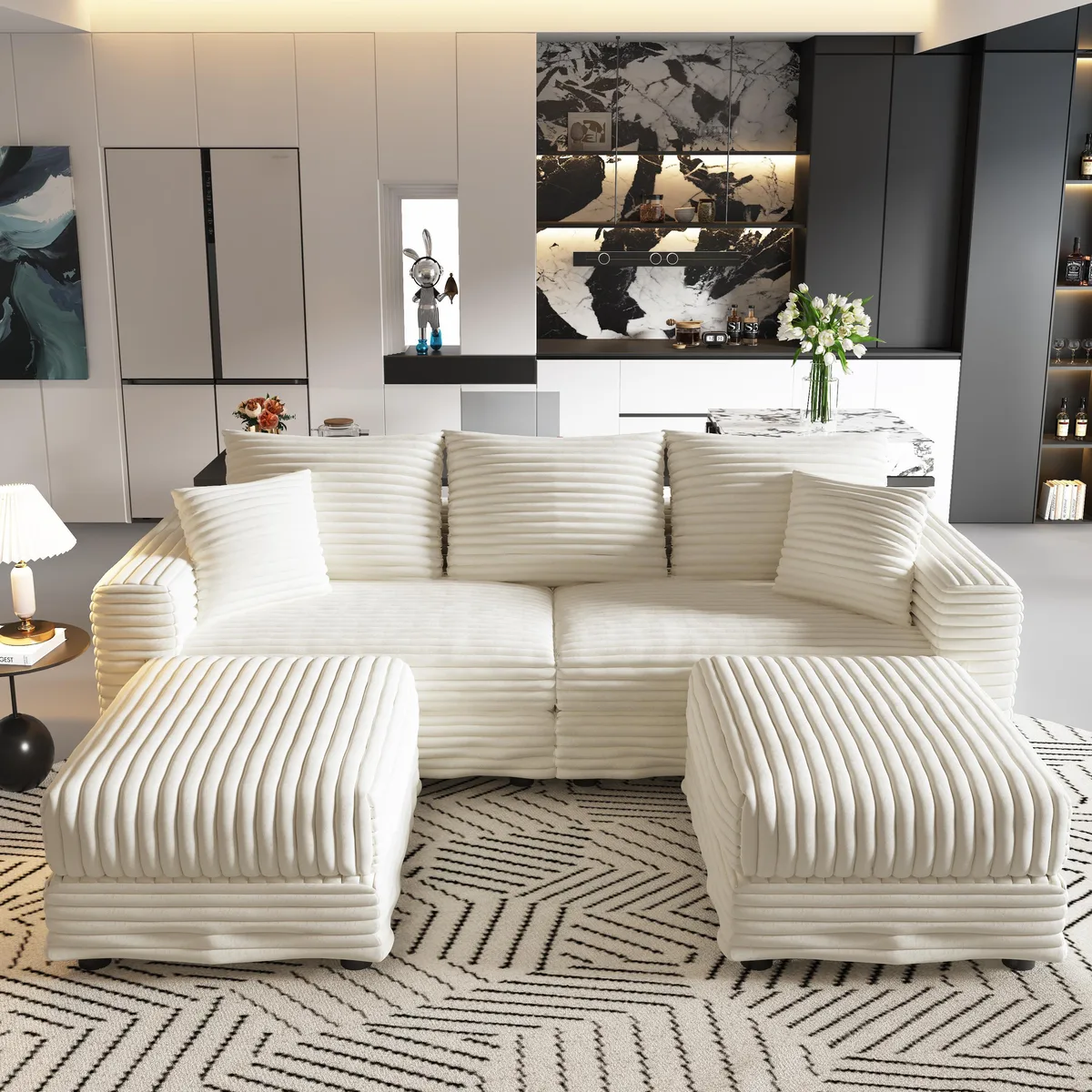 Beige and white three-seat corduroy sofa with two matching ottomans
