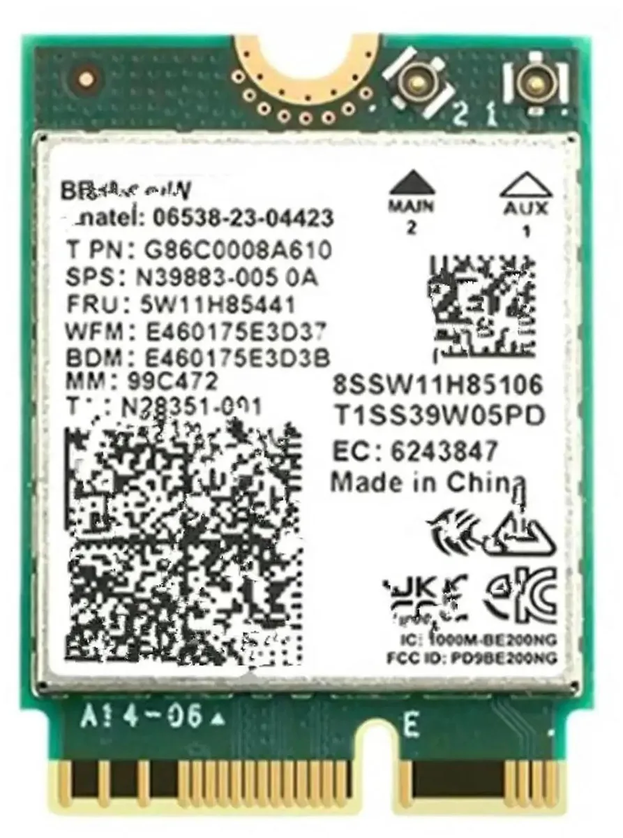 Small green M.2 circuit board with gold edge connector and two antenna sockets