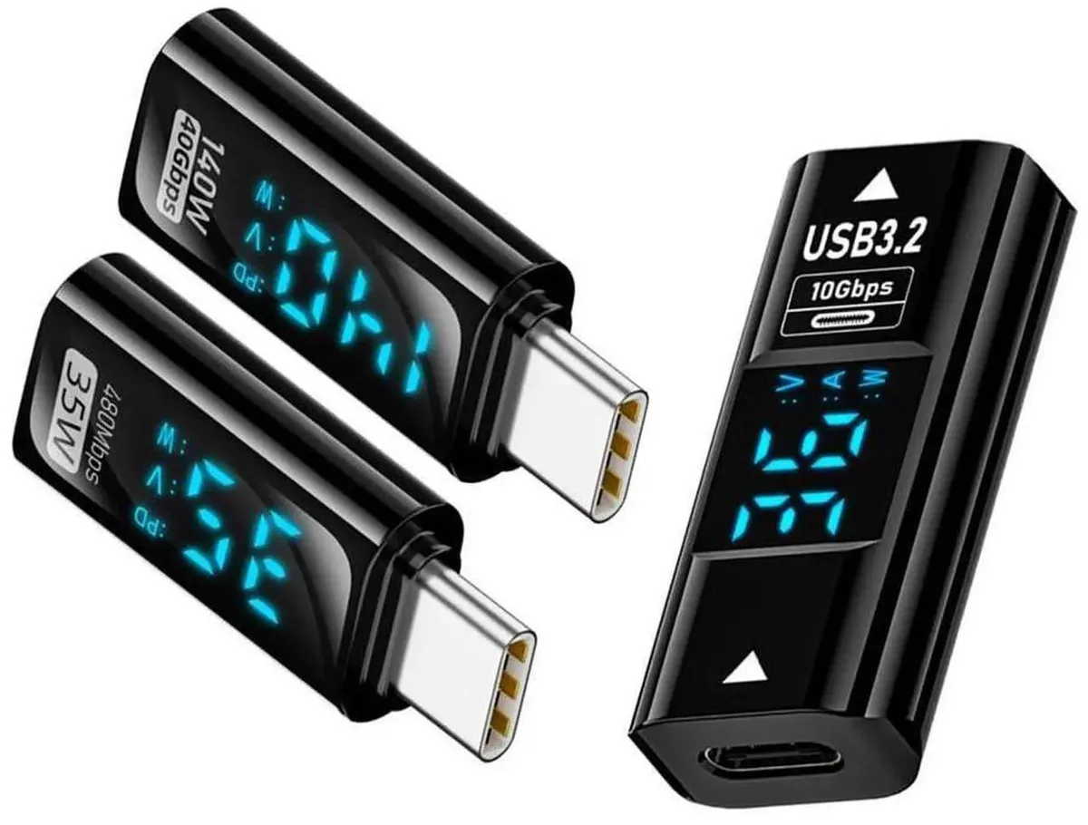 Three small USB-C to USB-A adapters with tiny LED screens