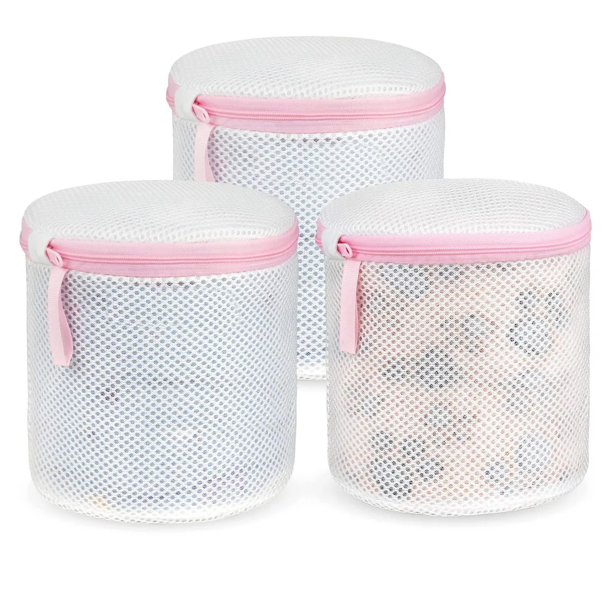 Three beige mesh laundry bags with zip closures lying flat