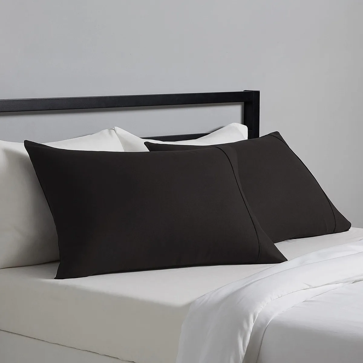 Two black microfiber pillowcases, standard size 20 by 30 inches