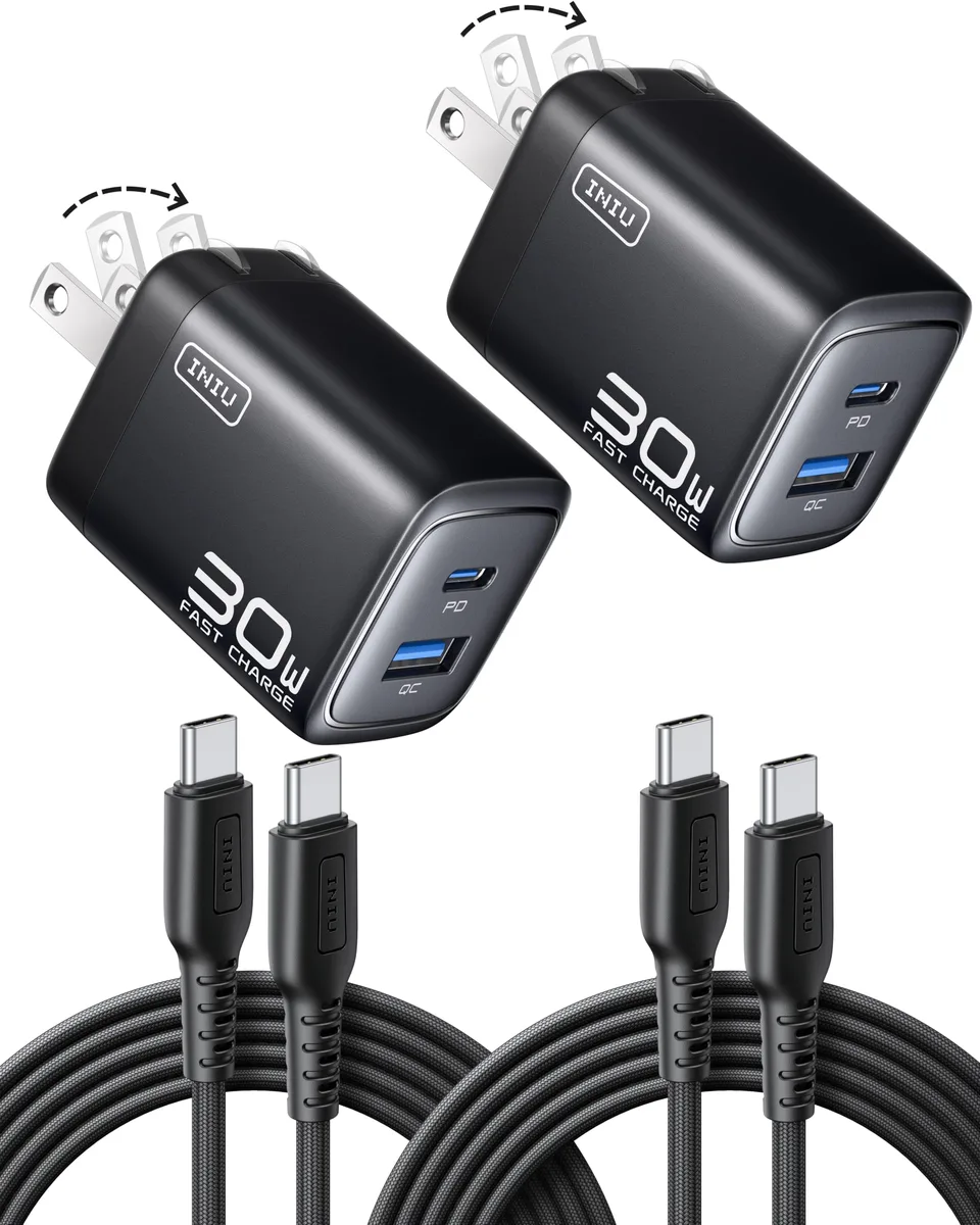 Two compact white USB-C chargers with foldable prongs and two braided cables