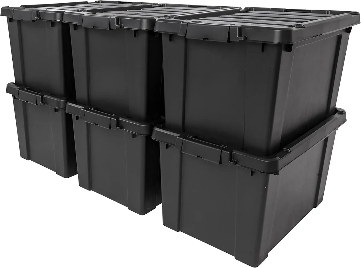 Six black rectangular plastic storage bins with lockable lids stacked together