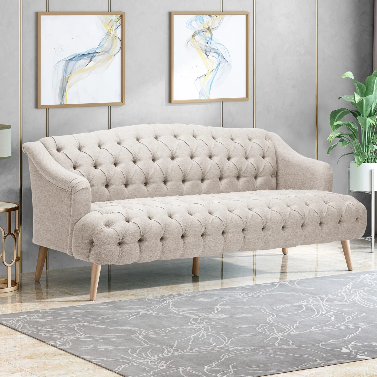 Beige fabric three-seat sofa with tapered birch legs and diamond button tufting