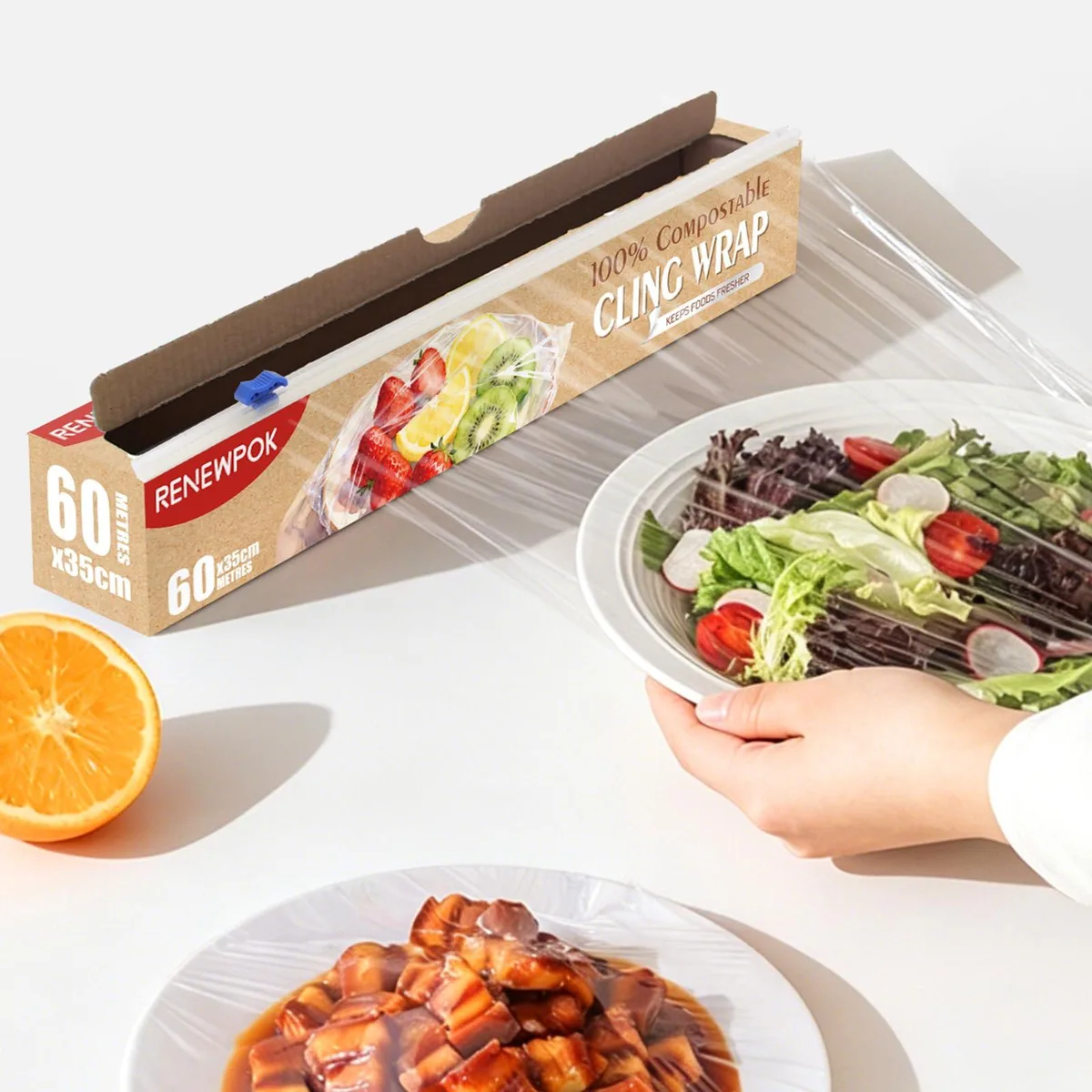 Clear compostable food wrap roll in a box with slide cutter stored in the core