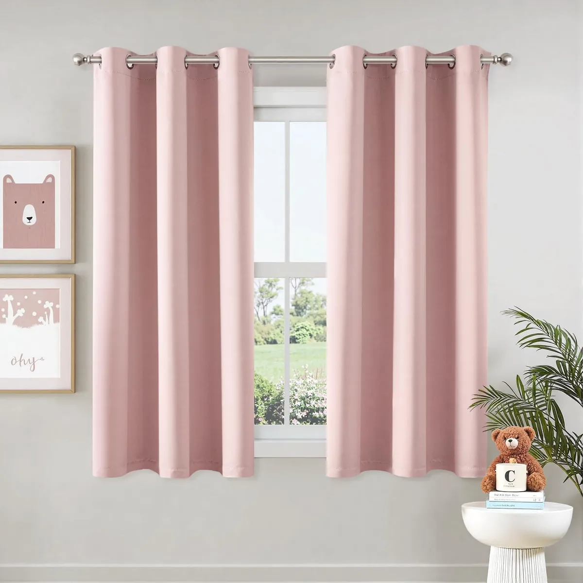 Pair of pink blackout curtain panels with silver grommets, 40 by 63 inches each