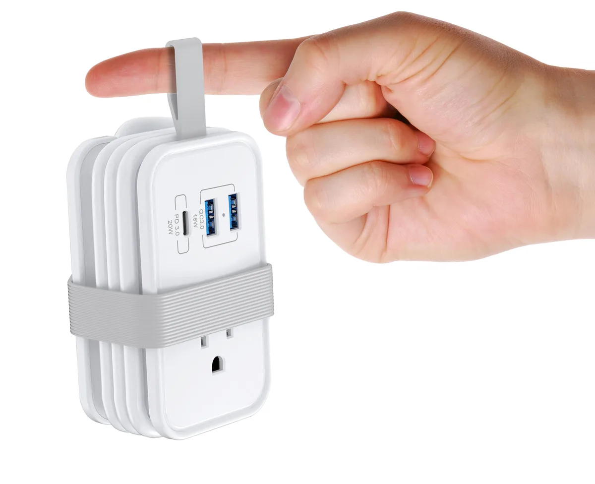 White rectangular travel power strip with three AC outlets, two USB-A ports, one USB-C port, flat plug