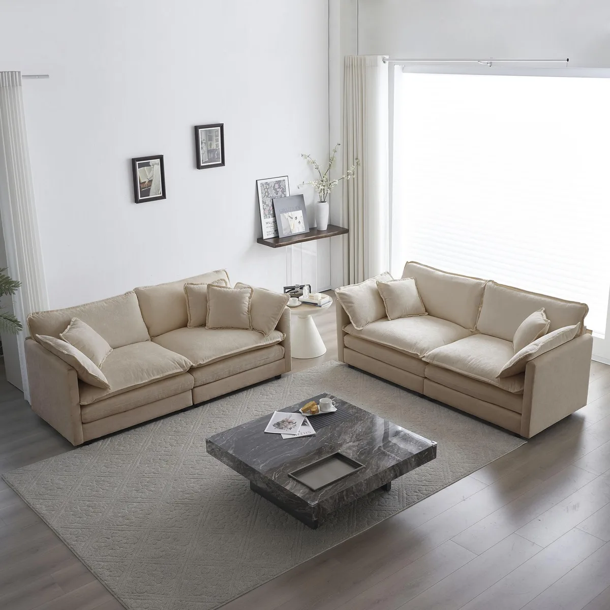 Two beige chenille two-seater sofas side by side