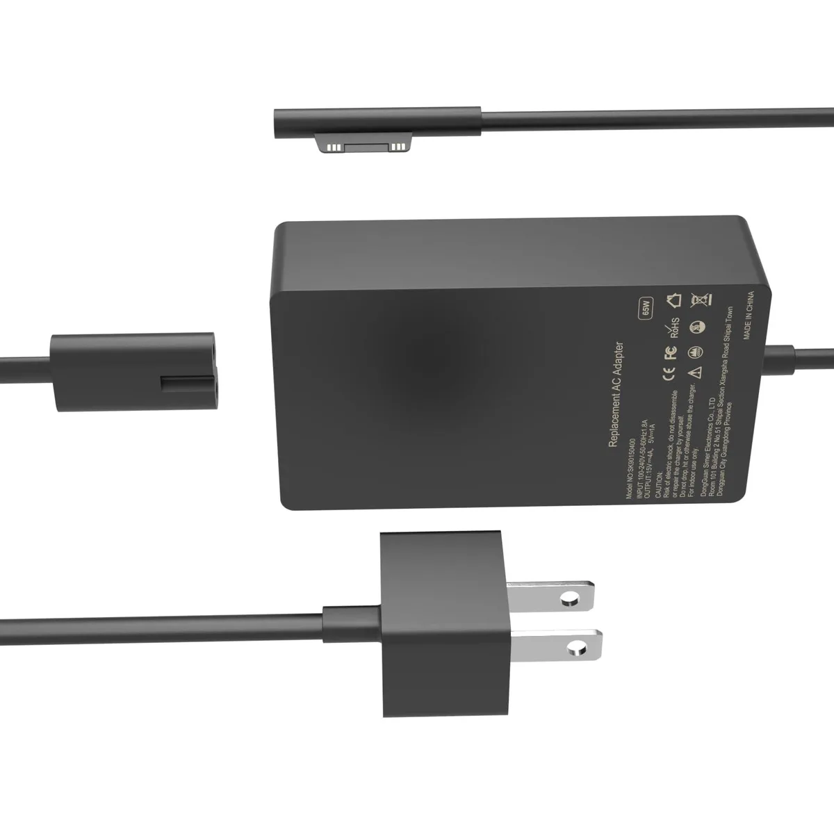 Black rectangular power brick with proprietary Surface connector and USB-A port, matte finish, coiled cable visible