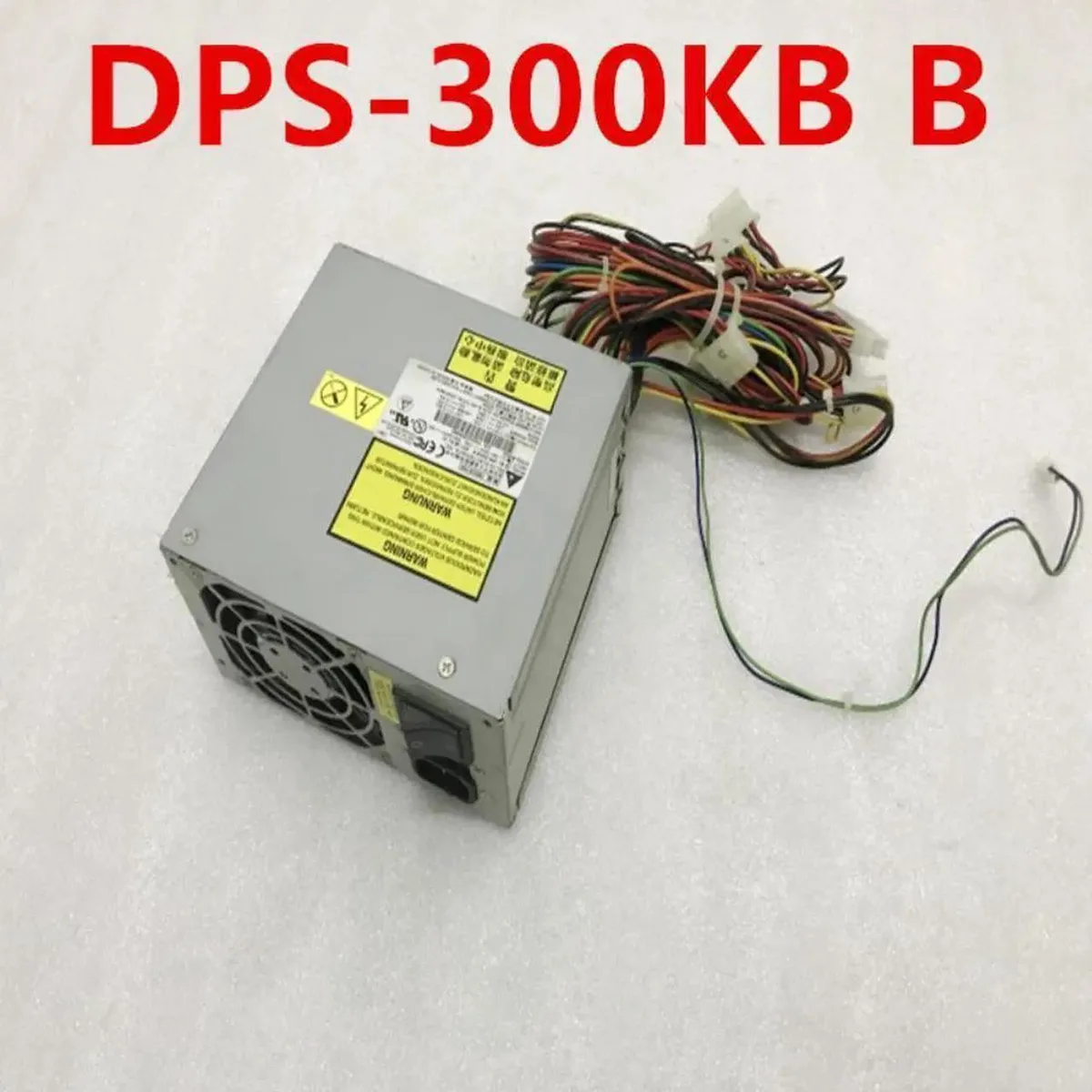 Rectangular metal power supply unit with 24-pin connector and 4-pin CPU plug