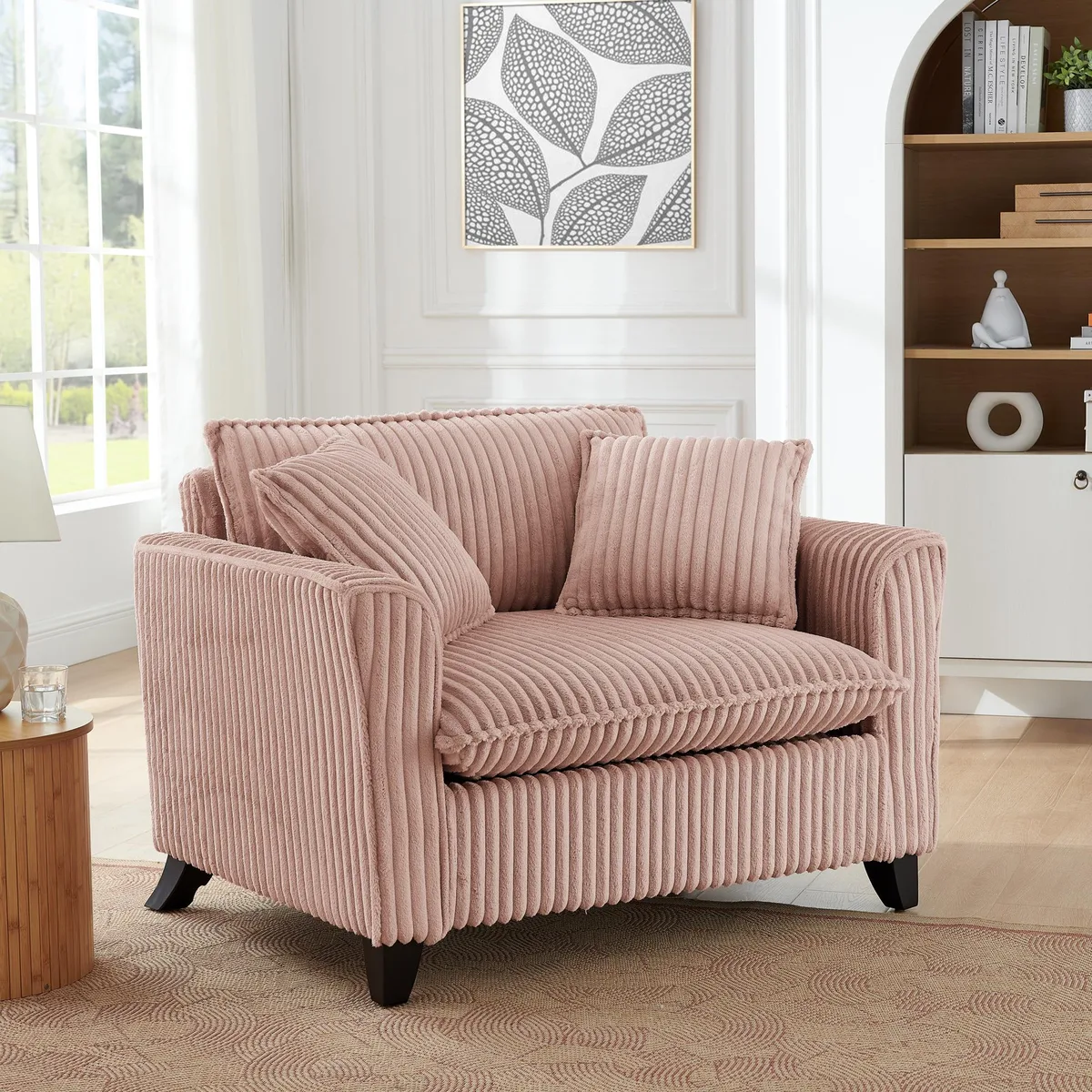 Pink corduroy single chair with tufted backrest, seat cushion and armrests