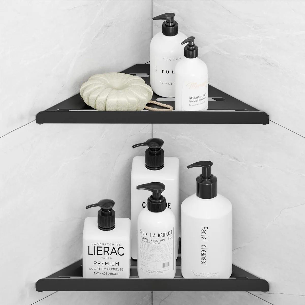 Two triangular black metal corner shelves with drainage holes
