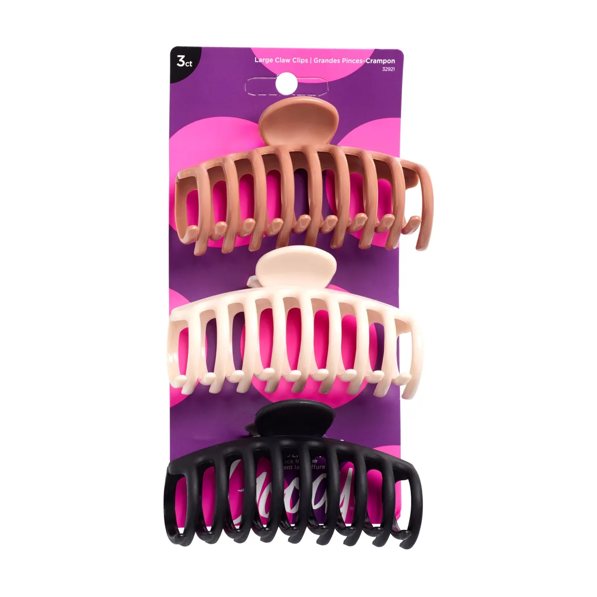 Three large spiral claw clips in brown, clear and black lying flat