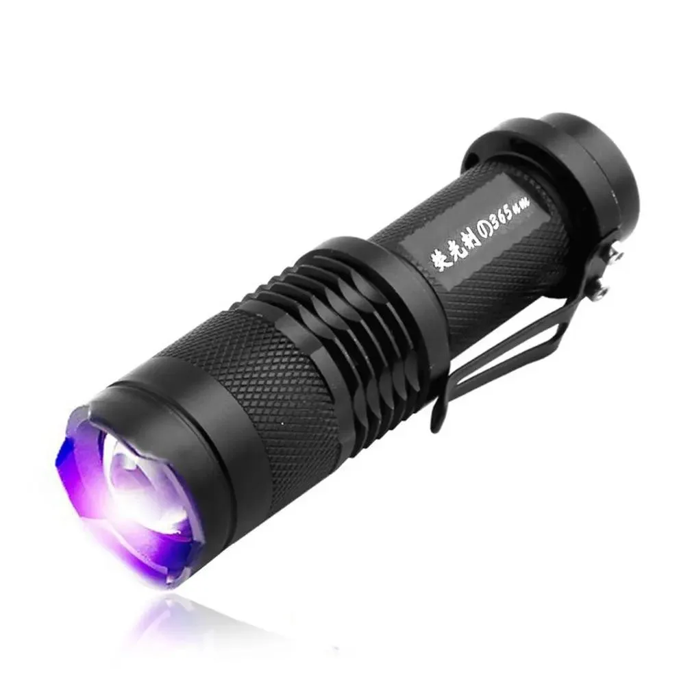 Compact UV flashlight with textured dark finish, single LED emitter, pocket clip and tail switch