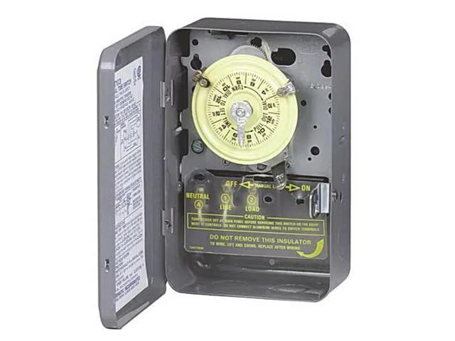 Gray metal electromechanical timer in steel enclosure