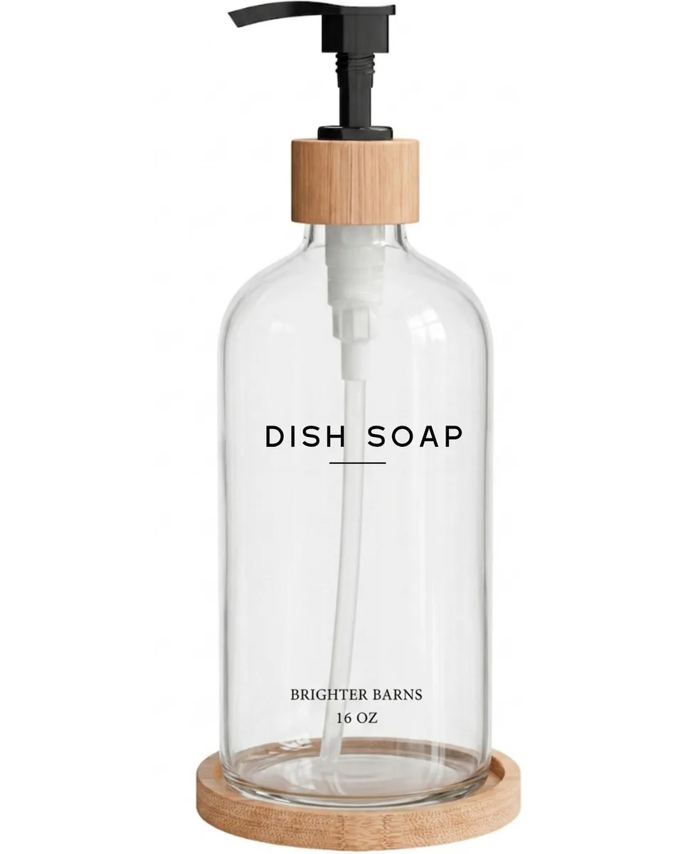Clear glass soap dispenser with bamboo pump on matching bamboo tray