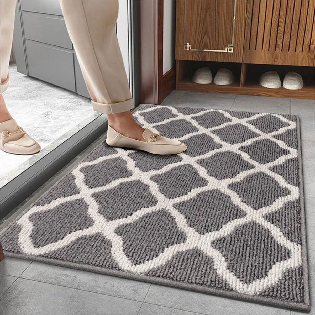 Light gray rectangular door mat with striped pattern, 20 by 32 inches