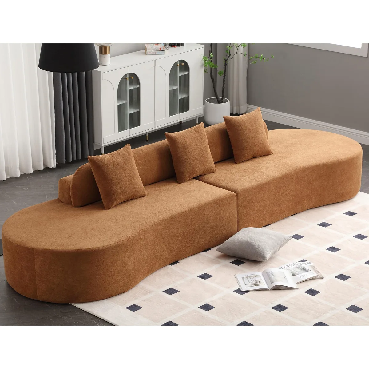 Brown curved modular sofa in terrycloth polyester with three pillows