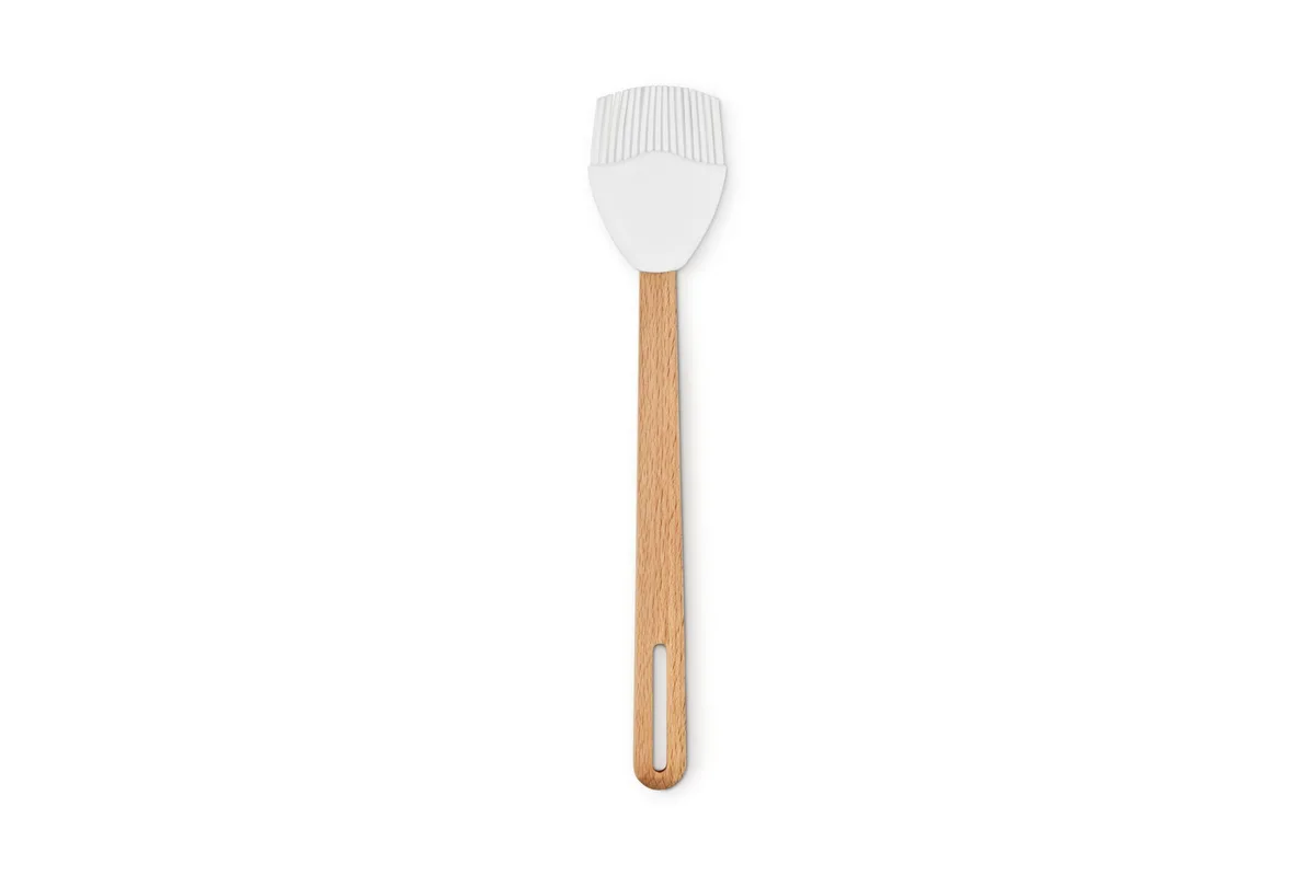 White silicone basting brush with beech wood handle and hanging loop