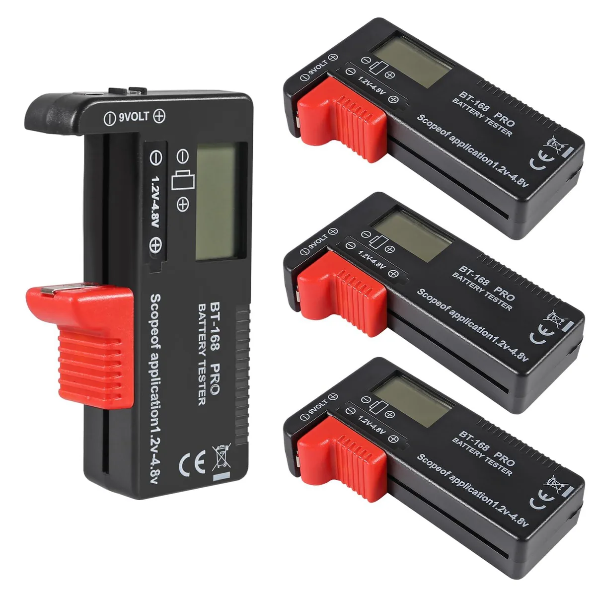 Four small black rectangular battery testers with analog needles and color-coded scales