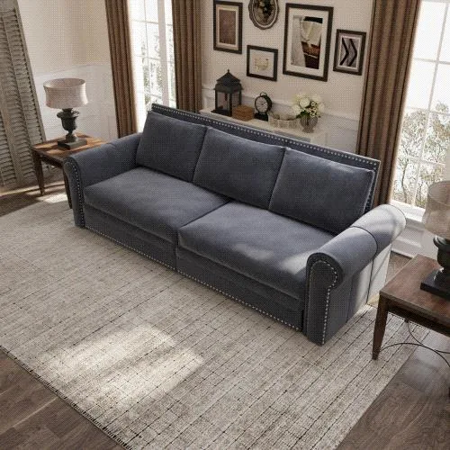 Grey velvet Chesterfield sofa bed with nailhead trim and rolled arms