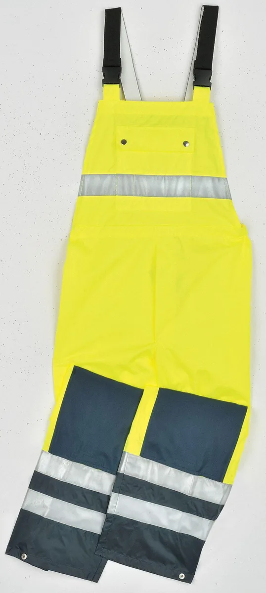 Yellow hi-vis bib pants with adjustable cuffs and reflective stripes