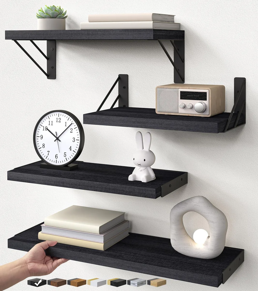 Four black L-shaped floating shelves with dark lacquered finish and triangular brackets
