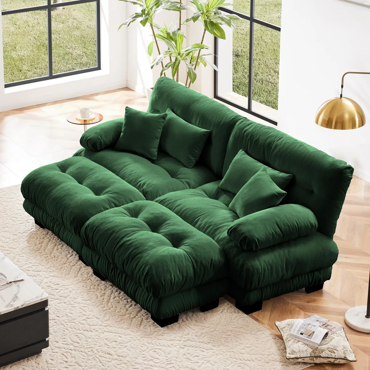 Green chenille two-seater sleeper sofa with wide round bolster arms, two ottomans, two lumbar pillows and two throw pillows