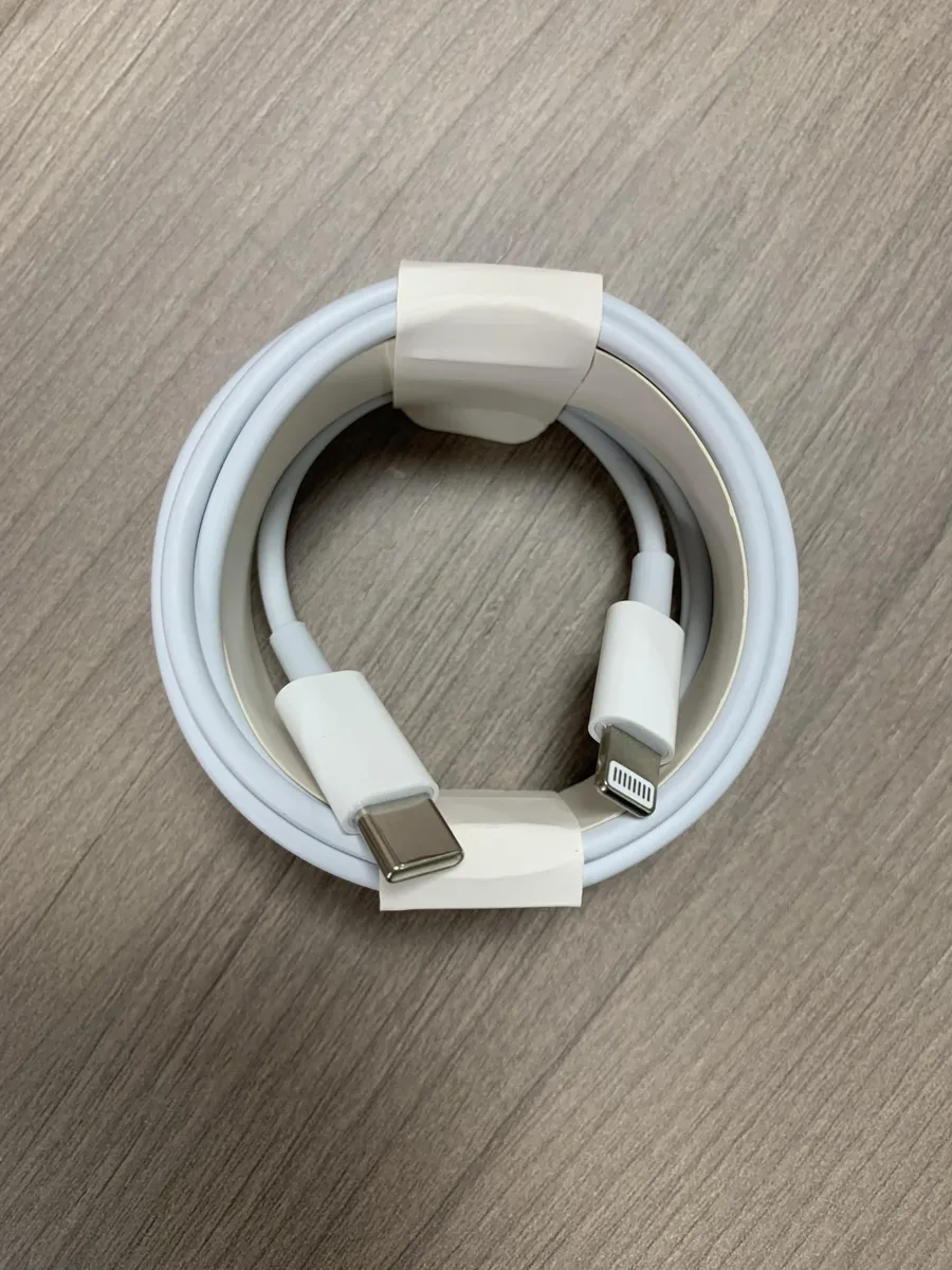 Two white braided USB-C to Lightning cables coiled together