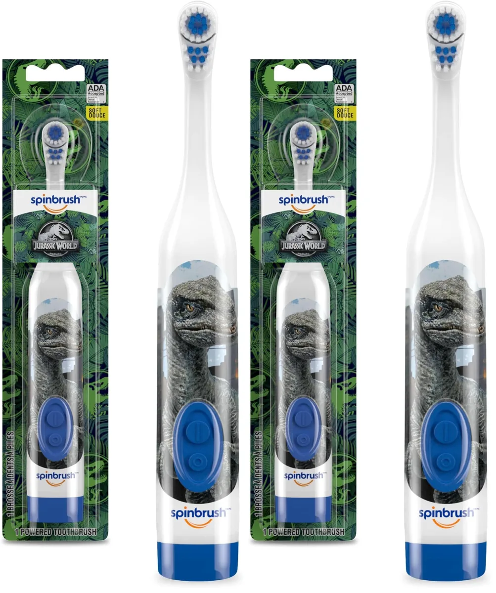 Two Jurassic World kids electric toothbrushes in colourful dinosaur packaging