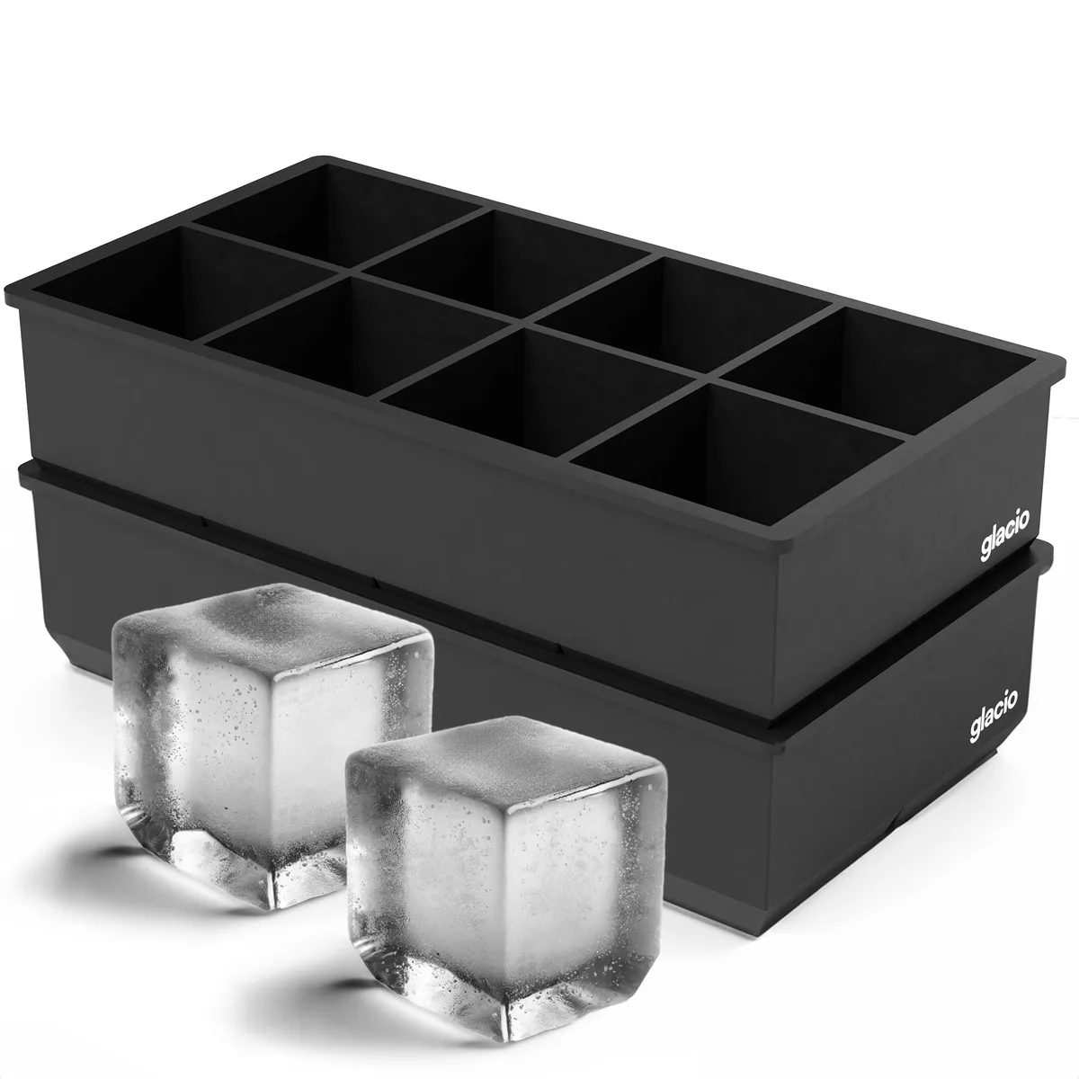Two black flexible silicone ice cube trays, each forming eight large square cubes