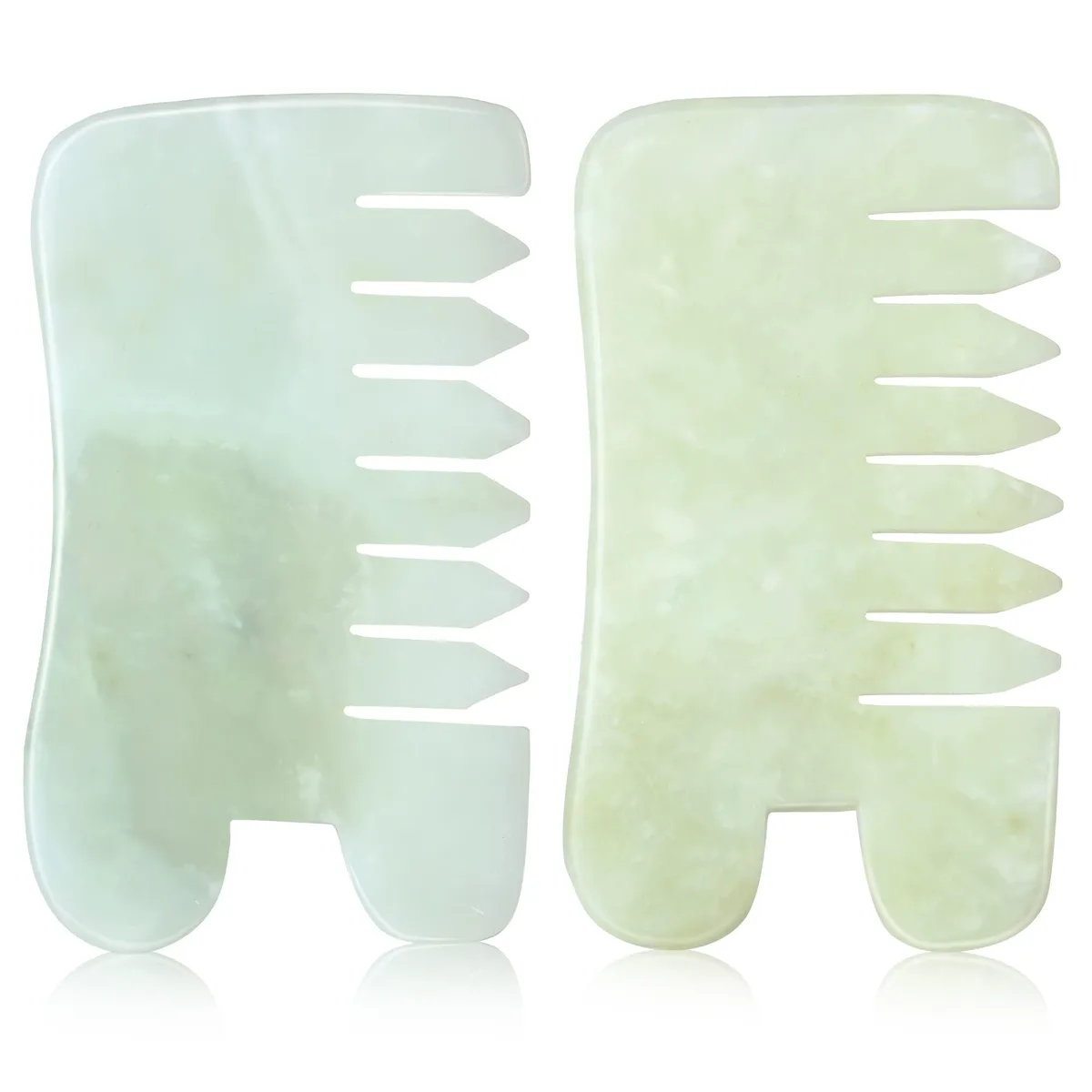Two smooth green jade combs, curved teeth, compact hand-held size