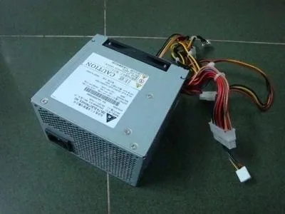 Rectangular silver server power supply unit with rear connectors and model label
