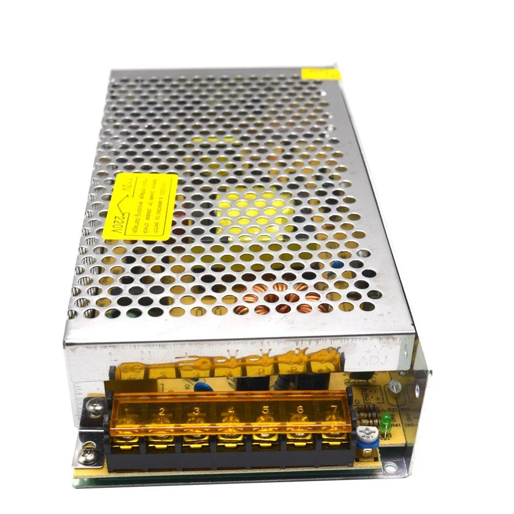 Silver metal rectangular power supply unit with screw terminals and voltage selector switch