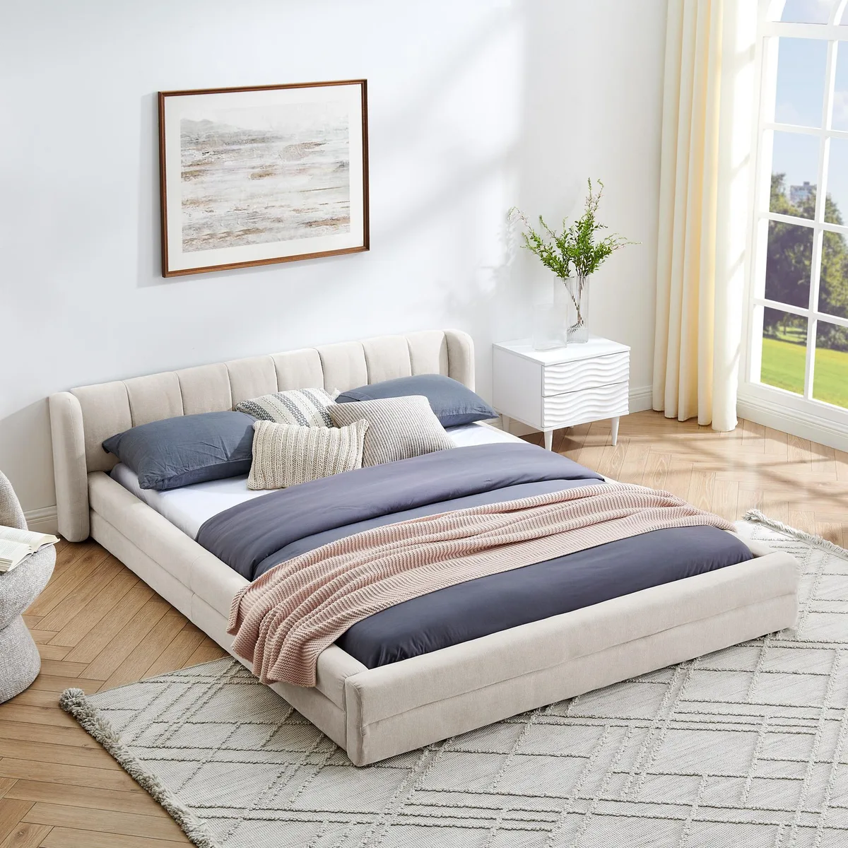 Beige chenille upholstered queen bed with headboard, low platform frame, fabric wrapped sides