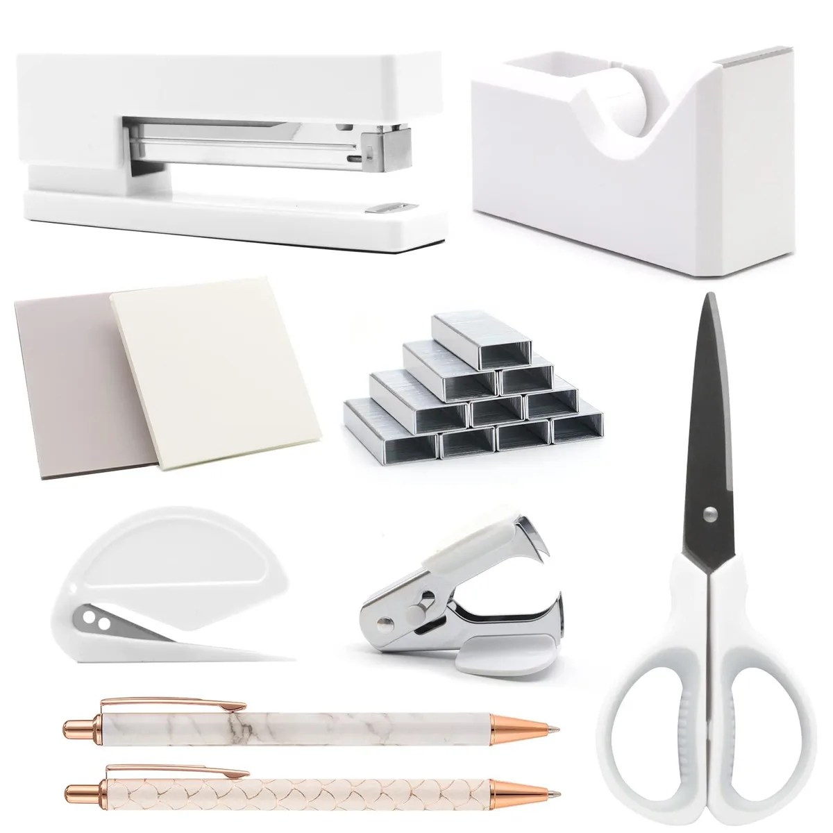 White desk accessory set with stapler, tape dispenser, scissors, pens and staples