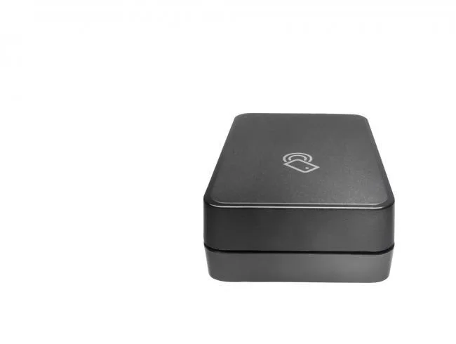 Small black rectangular wireless accessory with mini USB cables and Velcro kit
