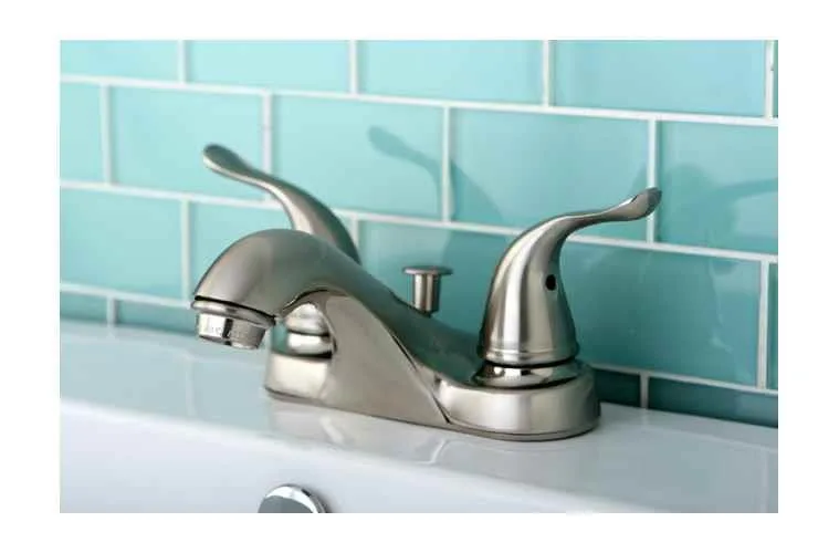 Brushed nickel two-handle centerset faucet with pop-up drain