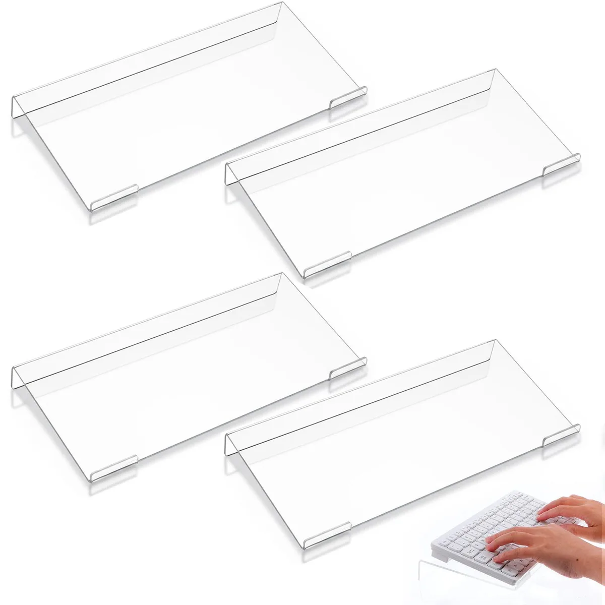 Four clear acrylic keyboard stands, tilted riser form, smooth transparent finish