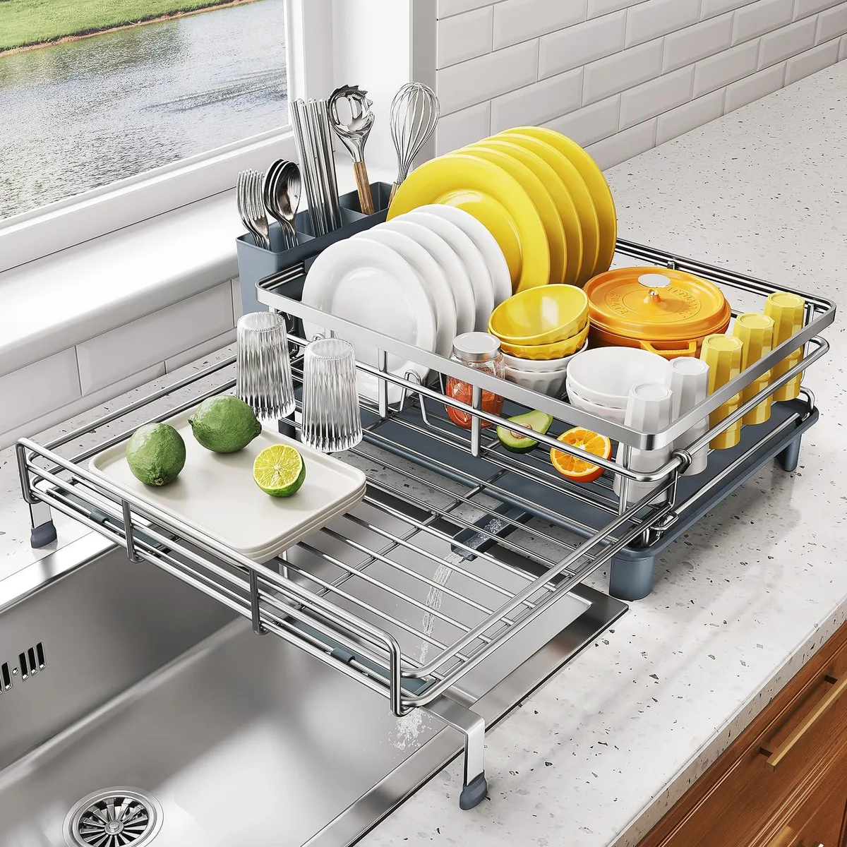 Red two-tier extendable dish rack over stainless steel frame with drainboard and utensil holder